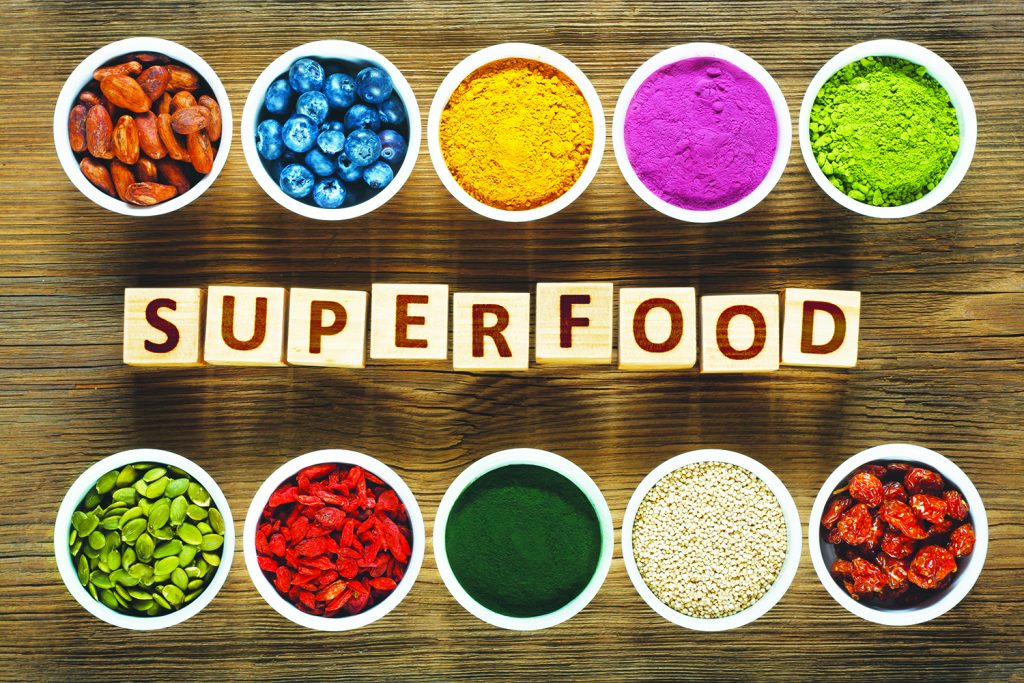 Superfoods on wooden table